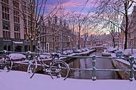 Besneeuwd Amsterdam Nederland bij zonsondergang van Eye on You thumbnail