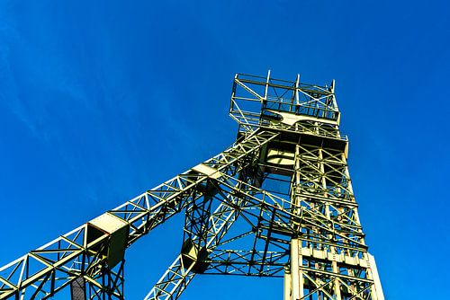 Steel frame of the winding tower of Carl Funke colliery in Essen in front of a blue sky