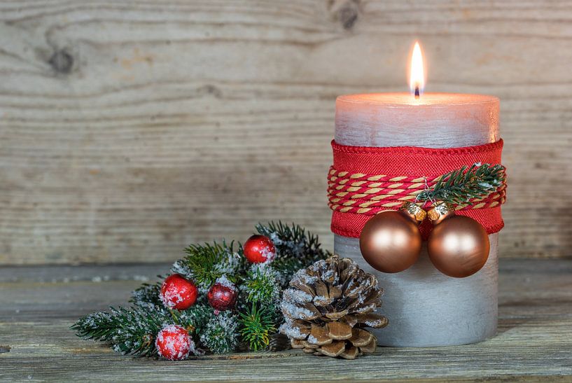 Decorated burning Advent candle flame and christmas golden balls by Alex Winter