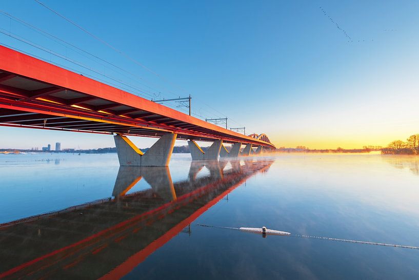 Hanzeboog train bridge over the river IJssel near Zwolle during sunrise by Sjoerd van der Wal Photography