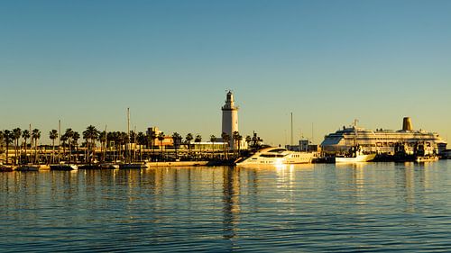 Lighthouse and ships in the port of Malaga Andalusia Spain