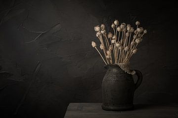 Still life with bouquet of dried poppy bulbs in stone pitcher (horizontal) by Mayra Fotografie
