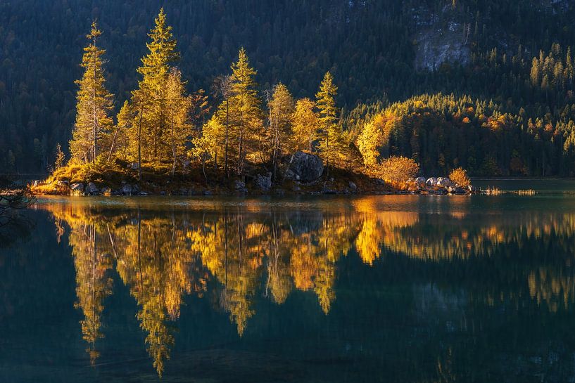 Small island on the Eibsee in Bavaria at the foot of the Zugspitze at sunrise in autumn by Daniel Pahmeier