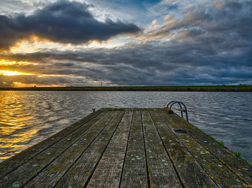 A jetty on the water by Martijn Tilroe