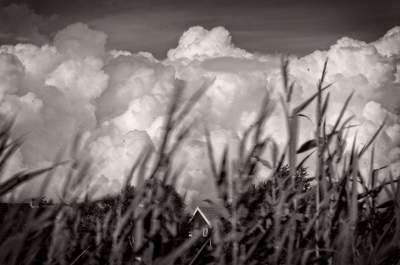 Clouds over the island Schiermonnikoog in black and white by Bert Tamboer
