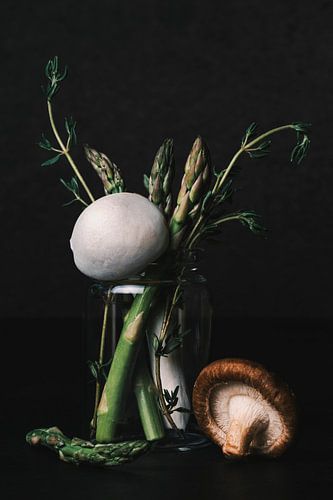 Still life bouquet of green asparagus, thyme and mushrooms