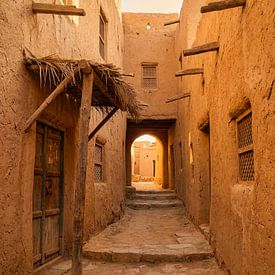 A cosy alleyway with an archway and mud-brick houses by But First Framing