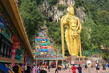 Prayer wheels with Lord Murugan and stairs to the Batu Caves by kall3bu