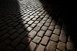 Cobblestones and sunset by Heiko Kueverling