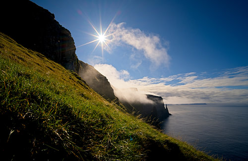A sunny view along cliffs and rock pillars