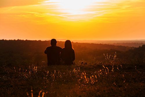 Lovers look into the sunset