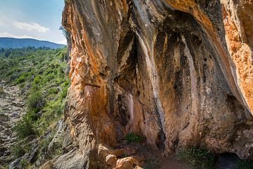 Coves Roges 4, red-brown rocks and caves by Adriana Mueller