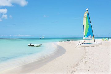 Sailboat on the beach on Aruba in the Caribbean Sea by Eye on You