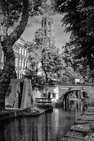 Utrecht's Dom tower in black and white seen from the Nieuwegracht canal