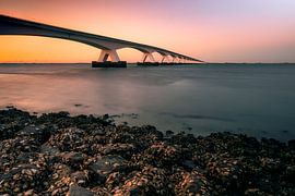Sea sand bridge with sunset