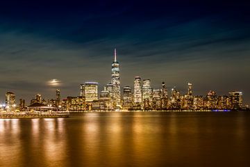 Lower Manhattan Skyline at night with harvest moon