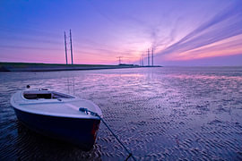 Evening glow, a little boat on the beach by Heleen Sandee