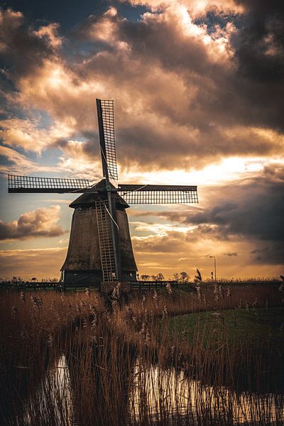 Mill with threatening sky by Paula van der Post