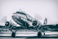 Vintage Douglas DC-3 airplane with turning props