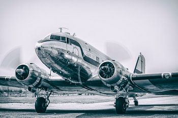 Vintage Douglas DC-3 airplane with turning propellors