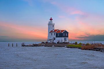 Lighthouse Het Paard van Marken on the IJsselmeer near Marken in the Netherlands with sunset by Eye on You