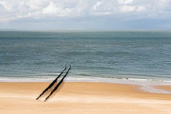 A deserted beach at Zoutelande with a row of breakwaters