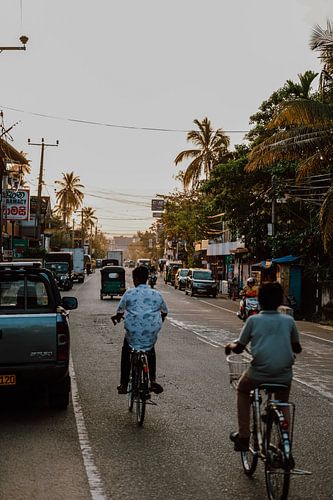Cycling boys during sunrise Sri Lanka