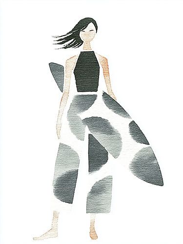 Une femme élégante en robe à motifs graphiques