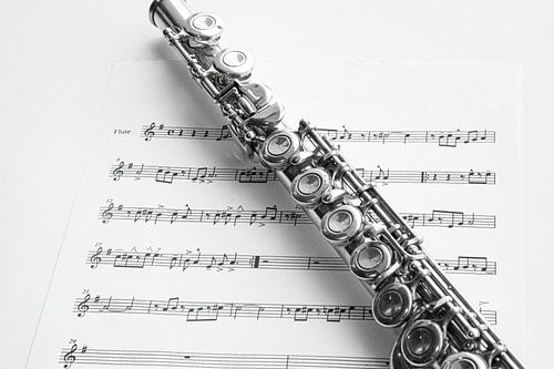 Transverse flute and sheet music, in black and white