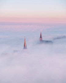 Harlingen above the mist at sunrise by Ewold Kooistra