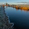 Ijs bij molen de Veenhuizer van peterheinspictures
