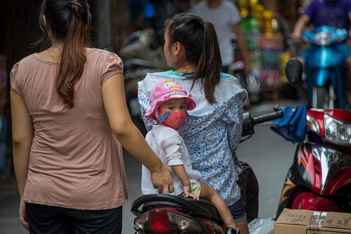 Kind op scooter