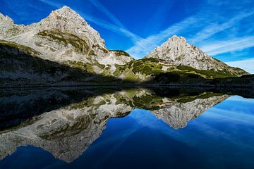 Reflection in the dragon lake in Austria Tirol Ehrwald. With Coburger Hütte and Sonnenspitze, front 