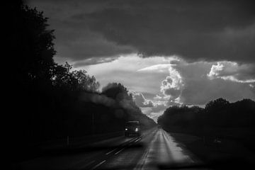 On the road in the rain black and white