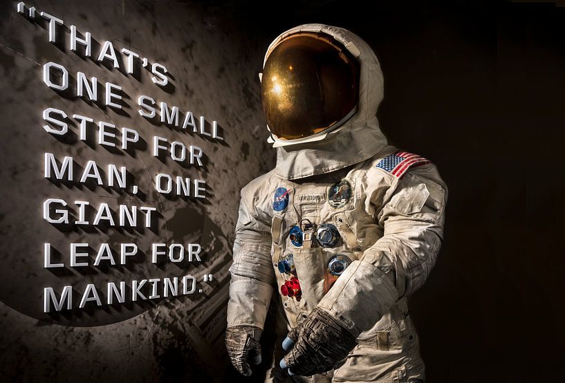 First man on the moon with the space suit and the text. by Brian Morgan