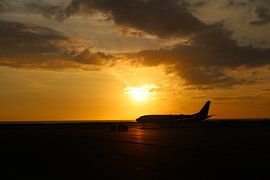 Sunset at the airport by G. van Dijk