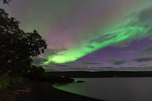Northen light under mountains. Beautiful natural landscape in the Iceland