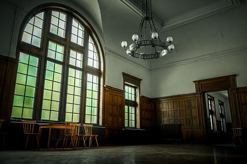 High windows and chandeliers in a room of the Lenoir orphanage