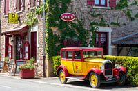 French hotel with vintage car