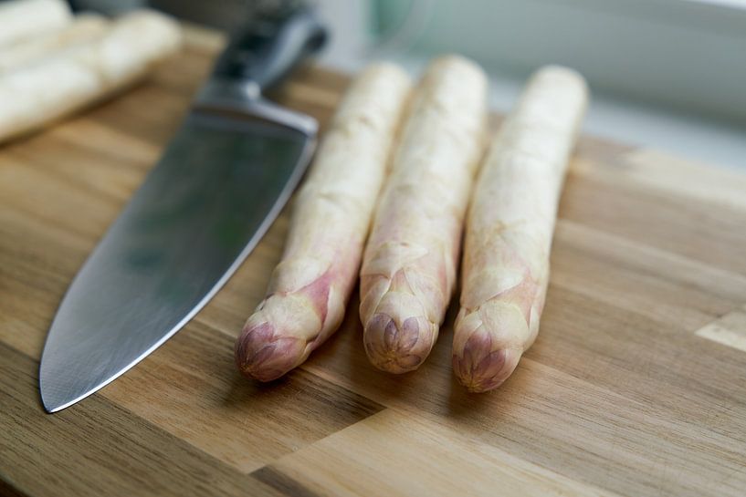 Fresh white asparagus in the kitchen by Heiko Kueverling
