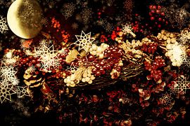 Christmas basket filled with berries by Helga Blanke