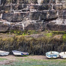 Boats at quay at low tide by Irma Meijerman