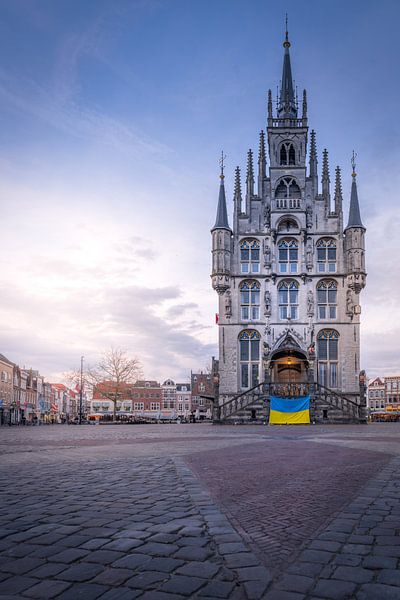 Gouda town hall with flag and sunset by Bart Ros