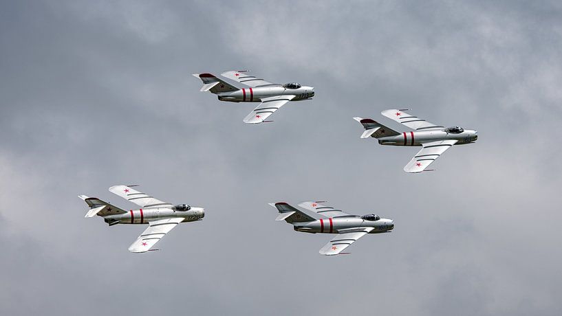Formation of Mig-17F Fresco fighters. by Jaap van den Berg