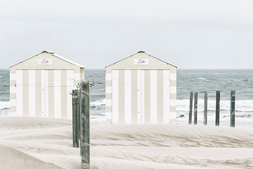 White-taupe striped beach cabins on the Belgian coast.