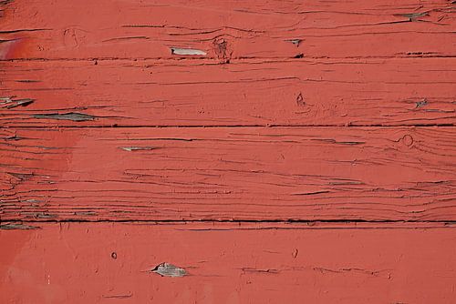 afbladderende oude verf op een houten muur