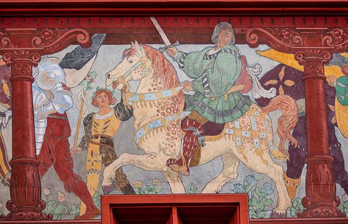 Heads next to windows of Basel Town Hall in Switzerland