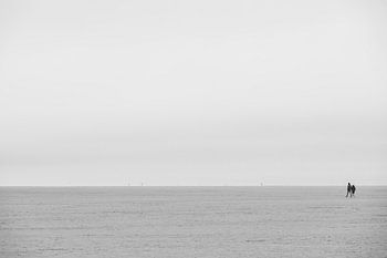 Two people on the beach of Sankt Peter-Ording