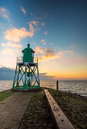 Harbor light lighthouse of Stavoren during sunset