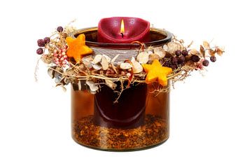 Christmas decoration with a burning candle on a white background by ManfredFotos